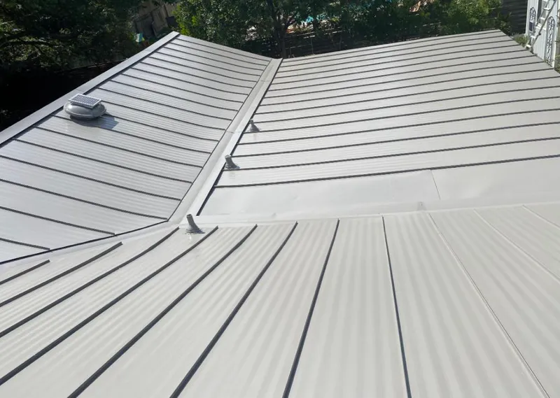 Solar attic fan installed on a metal roof for Roof Ventilation in Ellenton
